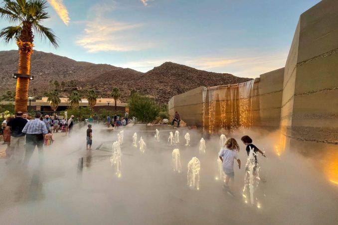 Downtown Park's splash pad at dusk. Cool air and cool water are the city's summer infrastructure.