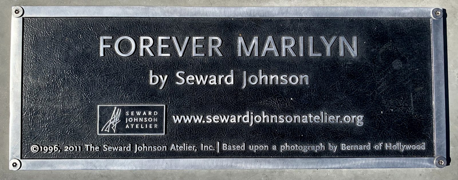 The plaque at the sculpture's base identifies it as "Forever Marilyn" by Seward Johnson, based on a photograph by Bernard of Hollywood.